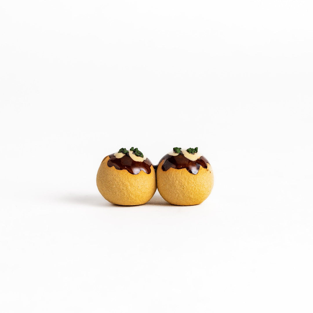 Adorable chopstick rest shaped like takoyaki, the popular Japanese snack, adding a playful touch to your table setting.