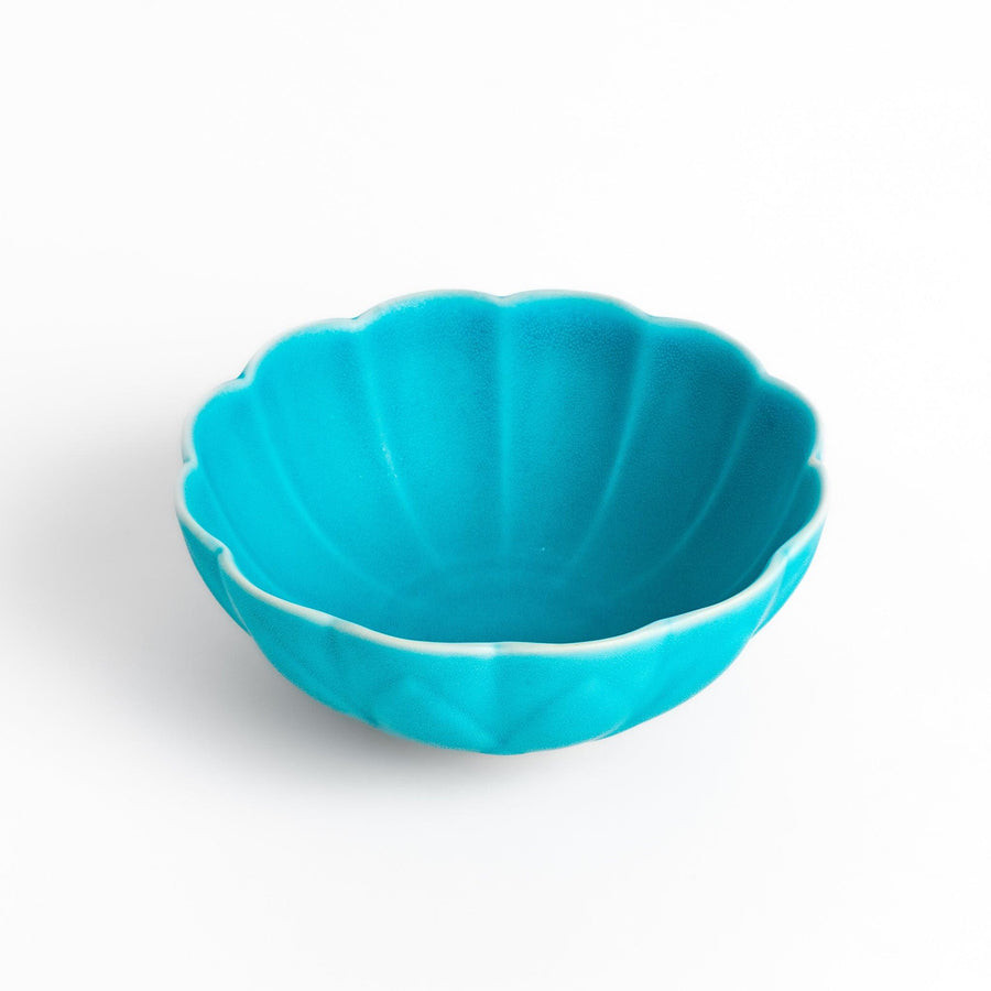 Turkish blue lotus-shaped dessert bowl with a smooth matte finish, featuring intricate petal-like details and a contrasting white base, perfect for serving desserts.