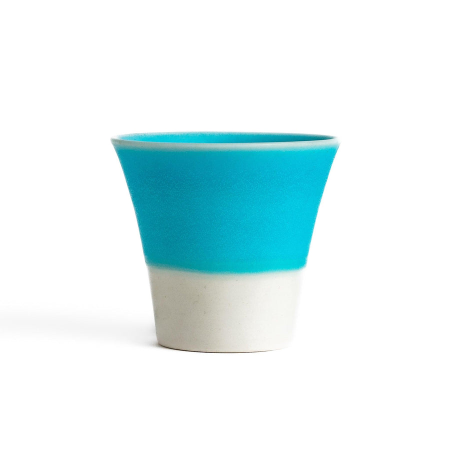 Turkish blue mini cup with a smooth matte finish and contrasting white base, perfect for serving small beverages or adding a pop of color to your tableware.