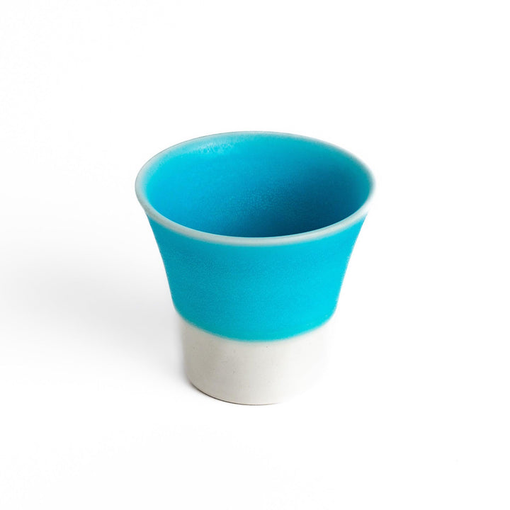 Turkish blue mini cup with a smooth matte finish and contrasting white base, perfect for serving small beverages or adding a pop of color to your tableware.