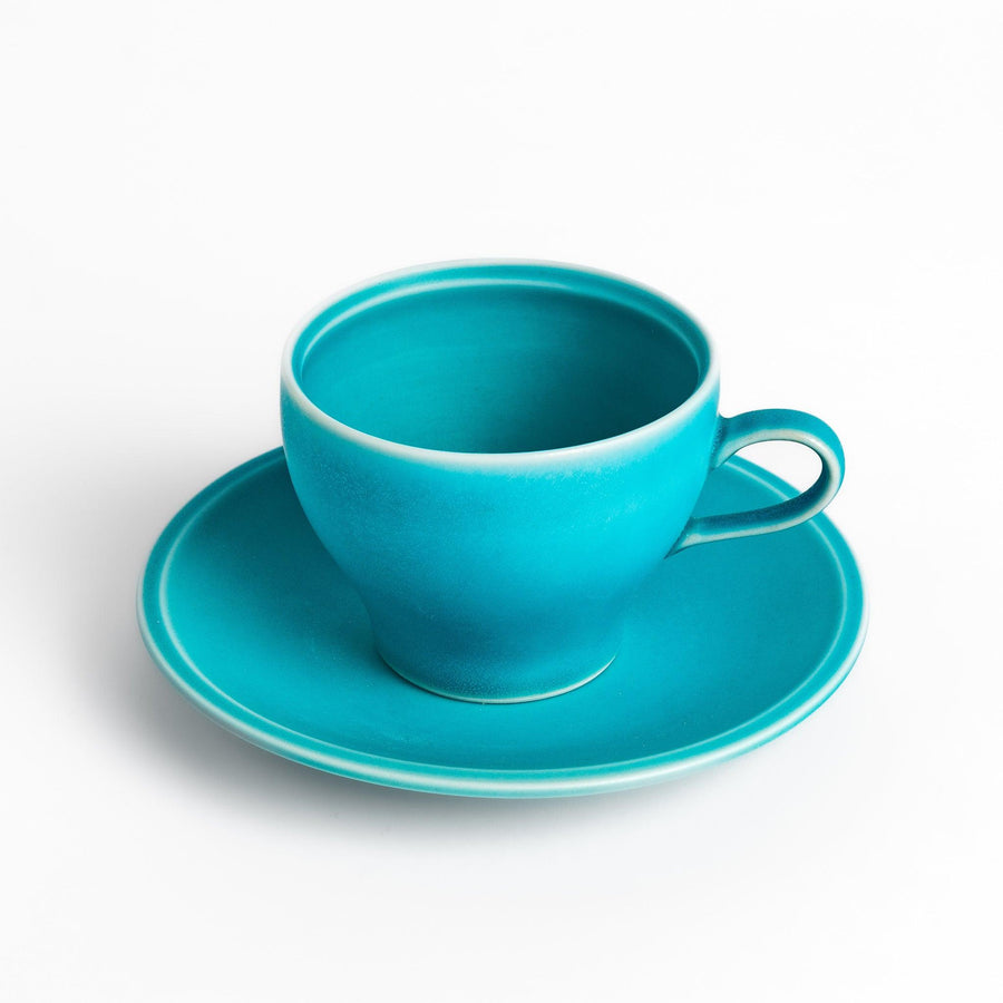 Turkish blue tea cup and saucer set with a smooth matte finish, offering a modern, vibrant touch to your tea rituals with its sleek and minimalist design.