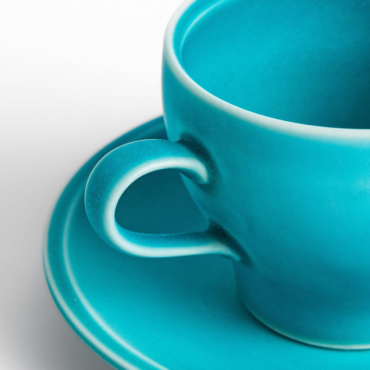 Turkish blue tea cup and saucer set with a smooth matte finish, offering a modern, vibrant touch to your tea rituals with its sleek and minimalist design.