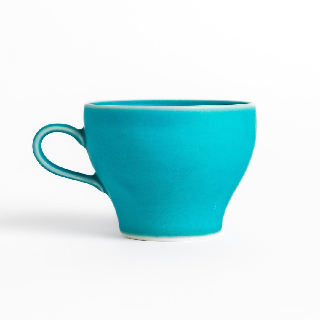 Vibrant Turkish blue tea cup with a smooth matte finish, featuring a contemporary design and a unique, elegant shape for your tea rituals.