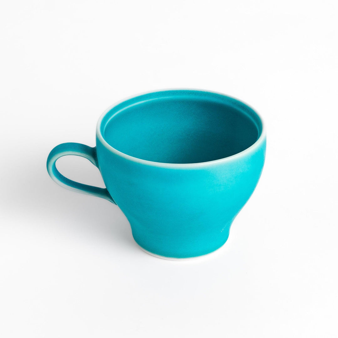 Vibrant Turkish blue tea cup with a smooth matte finish, featuring a contemporary design and a unique, elegant shape for your tea rituals.