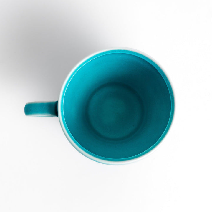 Vibrant Turkish blue tea cup with a smooth matte finish, featuring a contemporary design and a unique, elegant shape for your tea rituals.