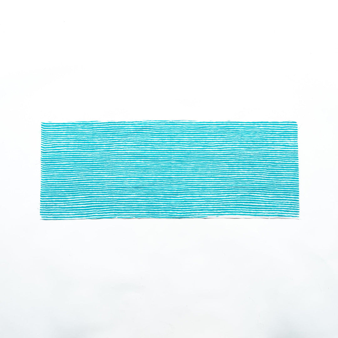 Bright blue hand towel with vertical white stripes, laid flat for full view.