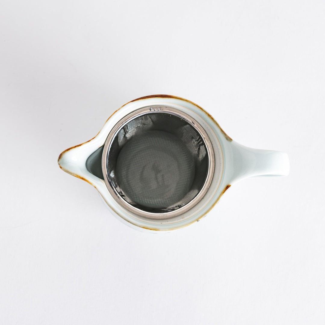 Teapot featuring a vintage-inspired vine pattern, perfect for serving tea in style and enhancing your table setting.