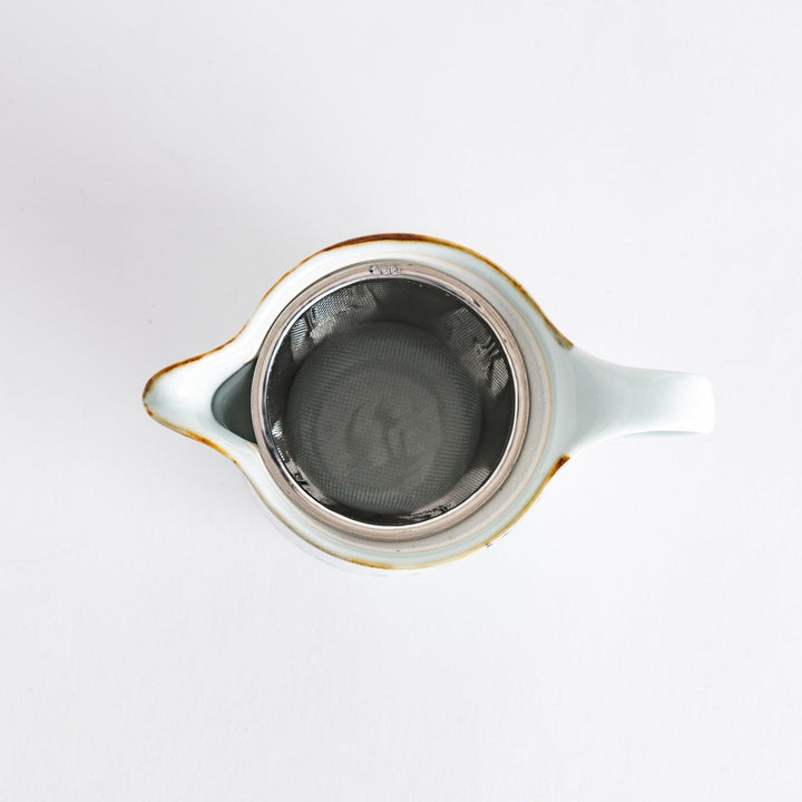 Teapot featuring a vintage-inspired vine pattern, perfect for serving tea in style and enhancing your table setting.
