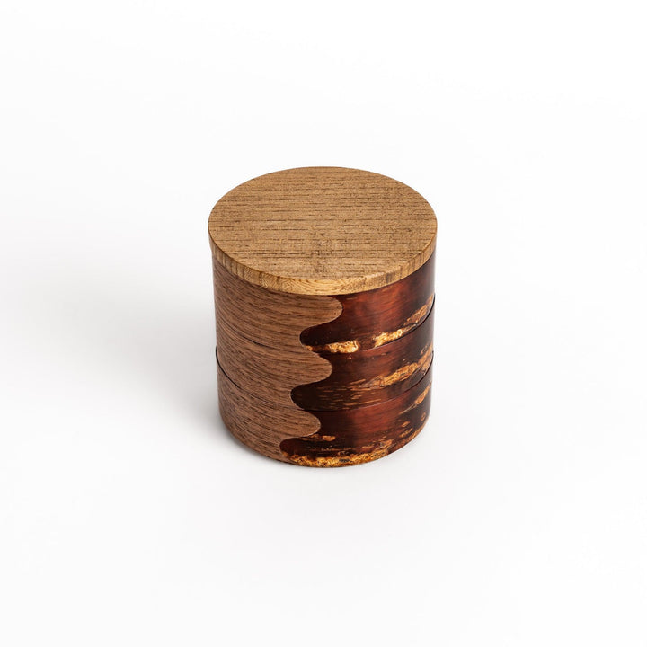 Exquisite jewelry case crafted from walnut and cherry bark, featuring a unique wavy design and a natural finish, perfect for storing precious treasures.