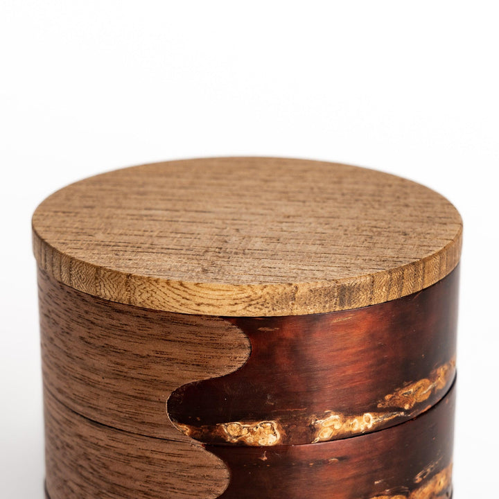Exquisite jewelry case crafted from walnut and cherry bark, featuring a unique wavy design and a natural finish, perfect for storing precious treasures.