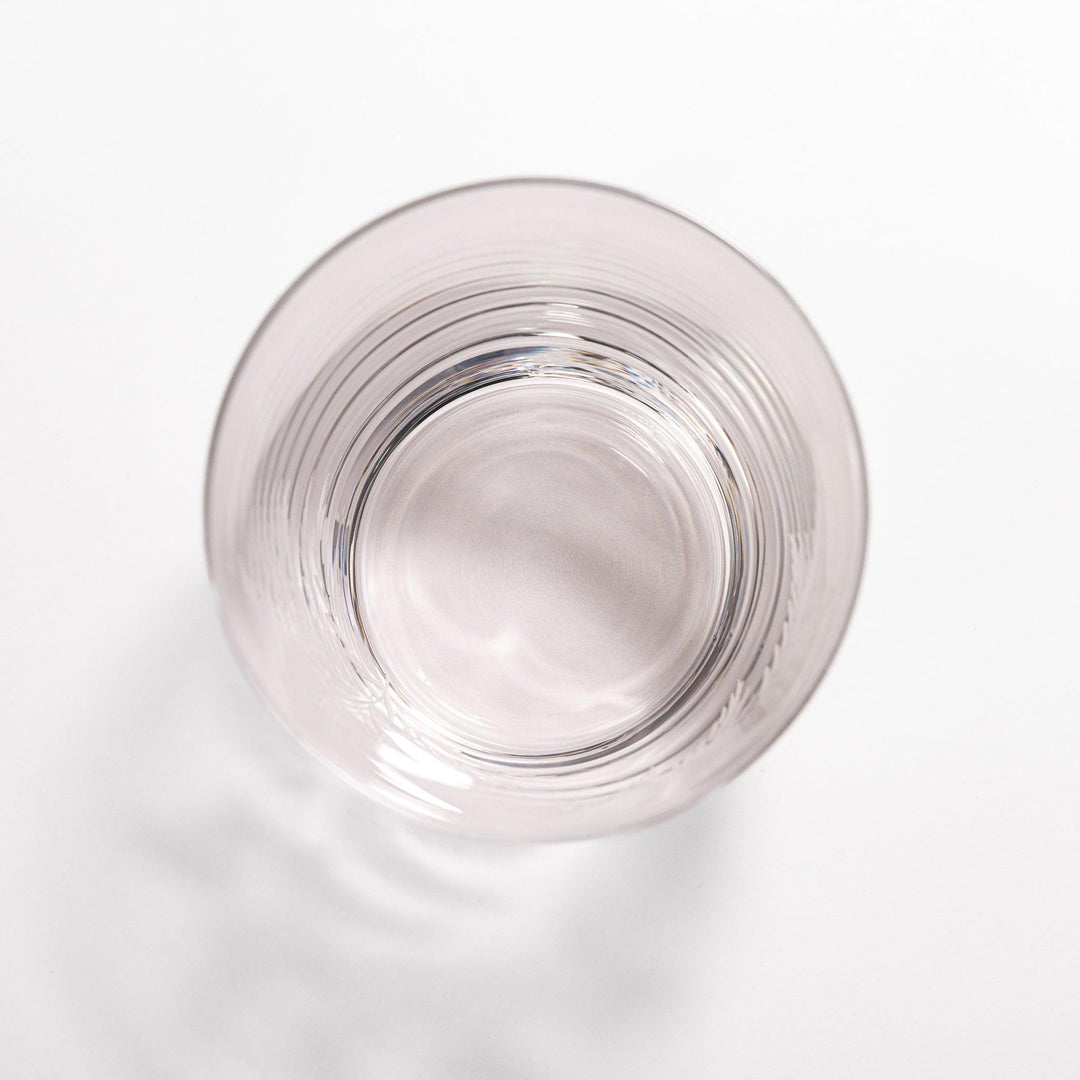 Elegant rocks glass with delicate fern engravings, offering a sophisticated design perfect for serving whiskey or other drinks.