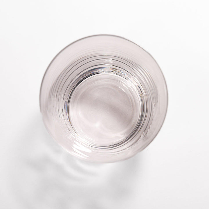 Elegant rocks glass with delicate fern engravings, offering a sophisticated design perfect for serving whiskey or other drinks.
