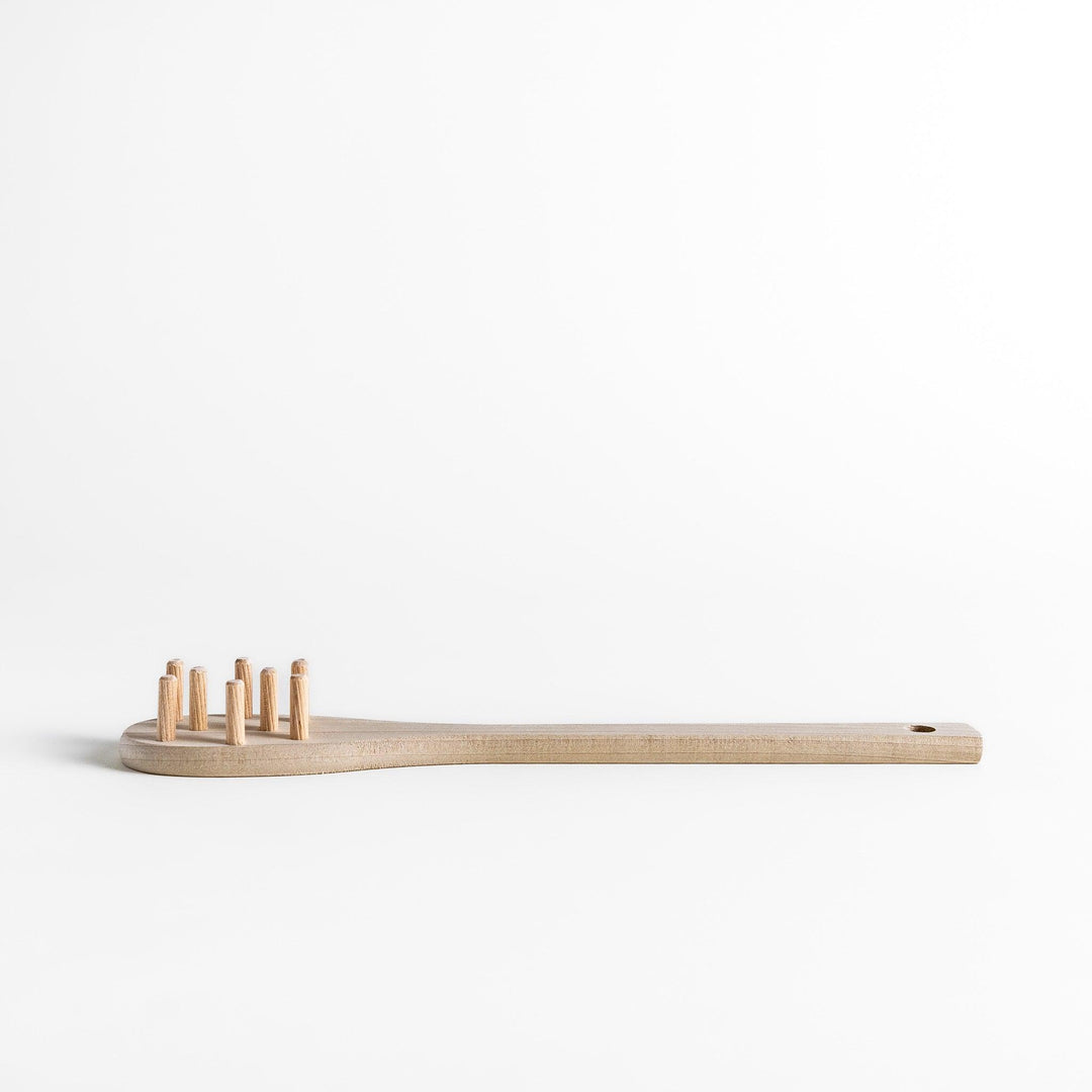 Wood Pasta Fork, a kitchenware tool with a wooden handle and forked design, ideal for stirring and serving pasta with ease while adding a natural touch to your kitchen.