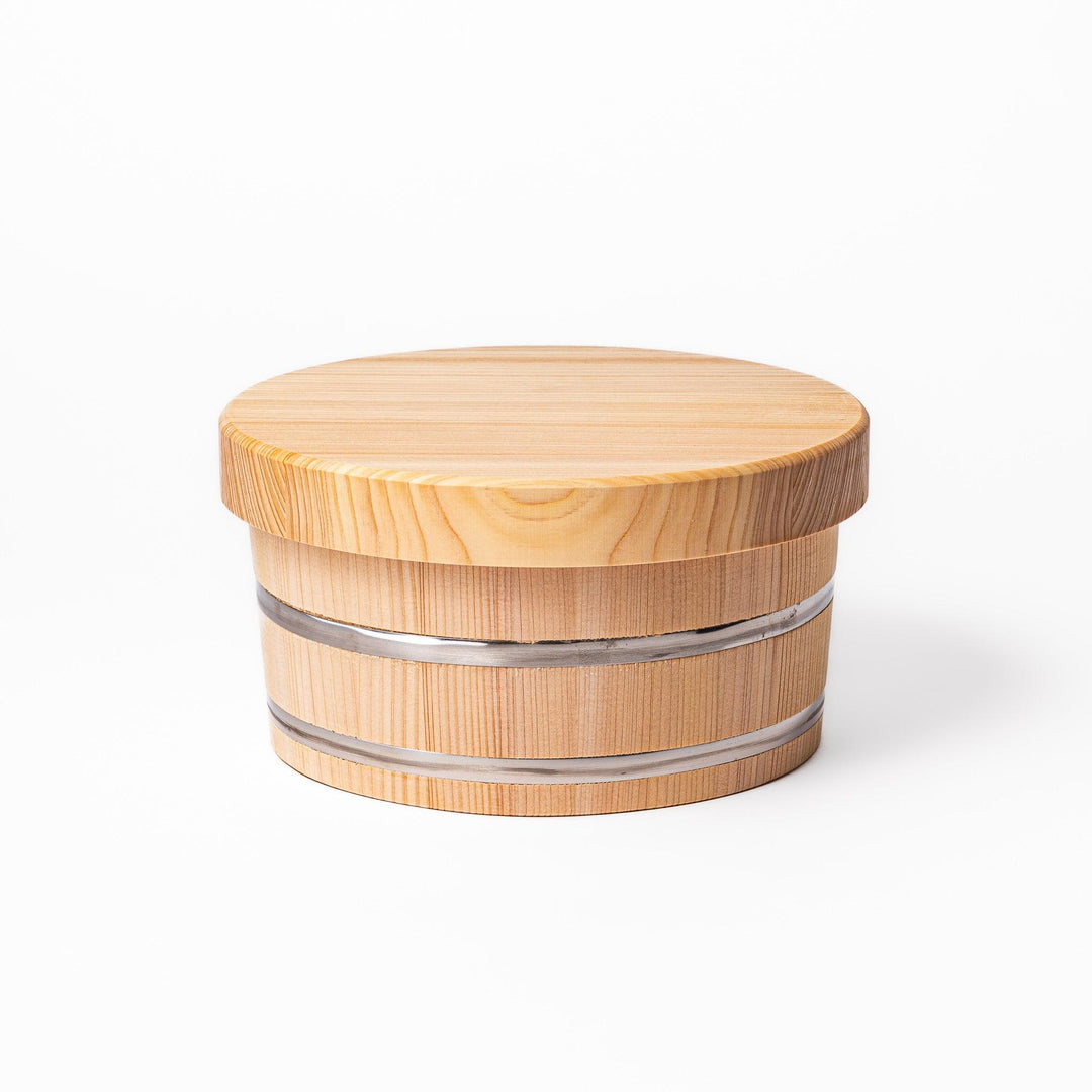 Wooden rice container with lid and paddle, made from natural wood with metal bands, ideal for storing and serving freshly cooked rice.