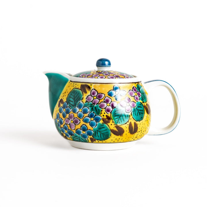 Vibrant yellow ceramic teapot with a colorful hydrangea pattern and a contrasting green spout. Perfect for adding a touch of cheer to your tea time.